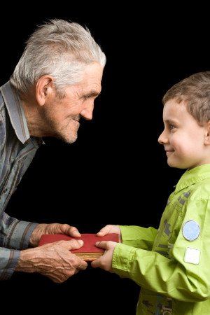 Grandfather and grandson with book