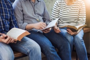 Group of people discussing books/writing